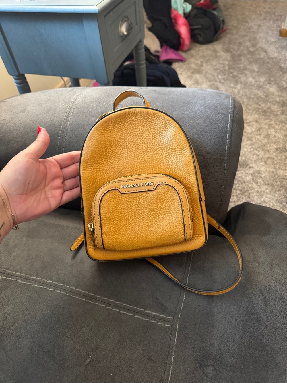 Michael Kors Pebbled Leather Mini Backpack in Mustard